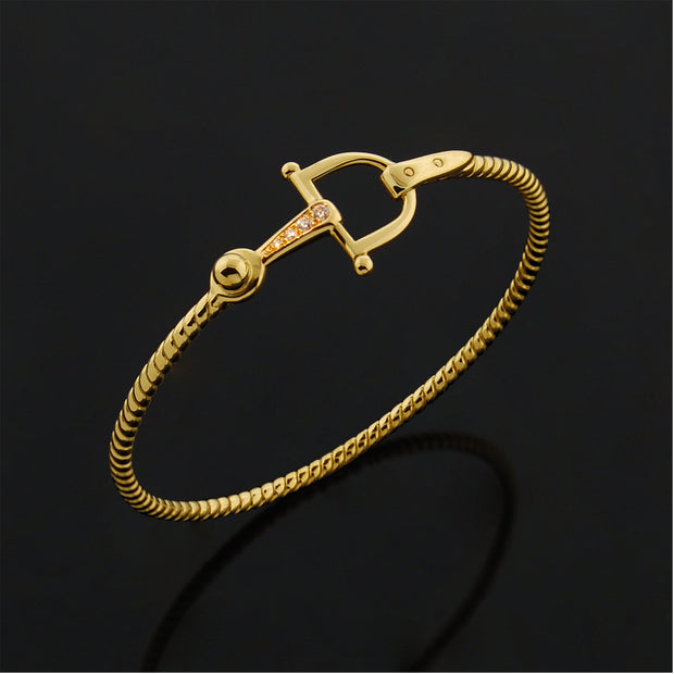 Designer solid 9ct Gold and Diamond horsebit inspired bangle on black