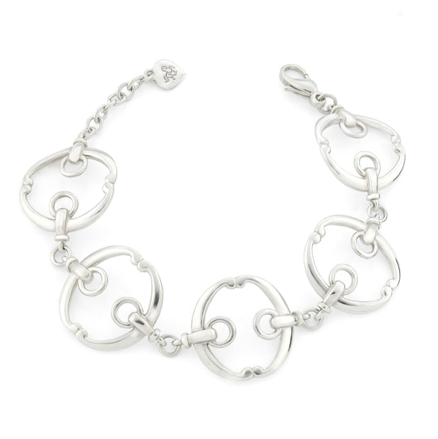 five piece solid silver designer equestrian bracelet on white background.