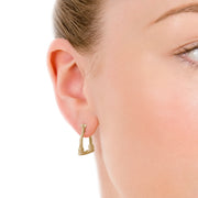 close up shot of model wearing designer 9ct gold vintage stirrup inspired hoop Badminton earrings.