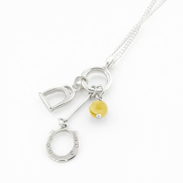 Designer solid silver horseshoe, stirrup and citrine charm necklace on white background