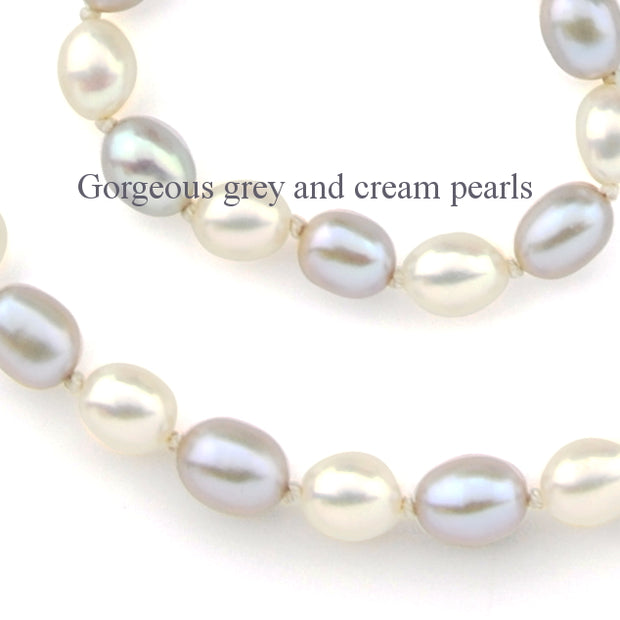 a close up image of the grey and cream colour of the cultured pearls in the necklace
