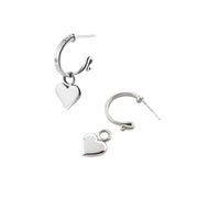 designer solid silver leather strap hoops with removable heart drop earrings on white background.