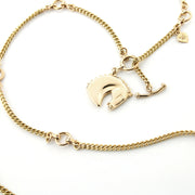 Heavy solid 9ct gold equestrian carved Horsehead necklace on white background.
