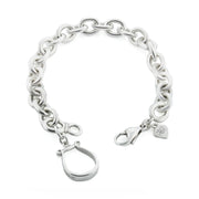Designer solid silver western stirrup heavy chain bracelet on white background.