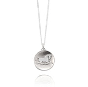 Designer solid silver horse inspired coin necklace on white background.
