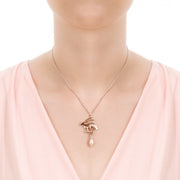 Skin shot of designer solid 9ct rose gold Hare withcultured  pearl drop necklace.
