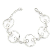 five piece solid silver designer equestrian bracelet on white background.