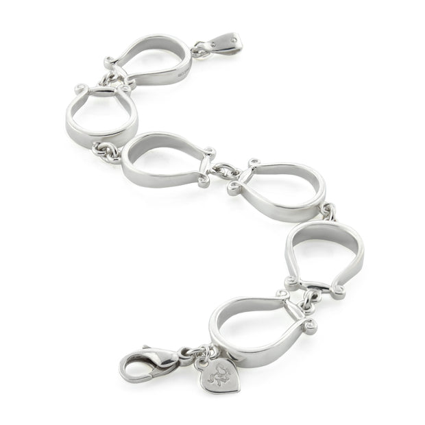Designer six western stirrup solid silver bracelet on white background.