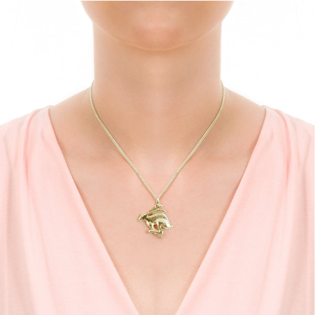 model wearing designer gold carved Hare necklace