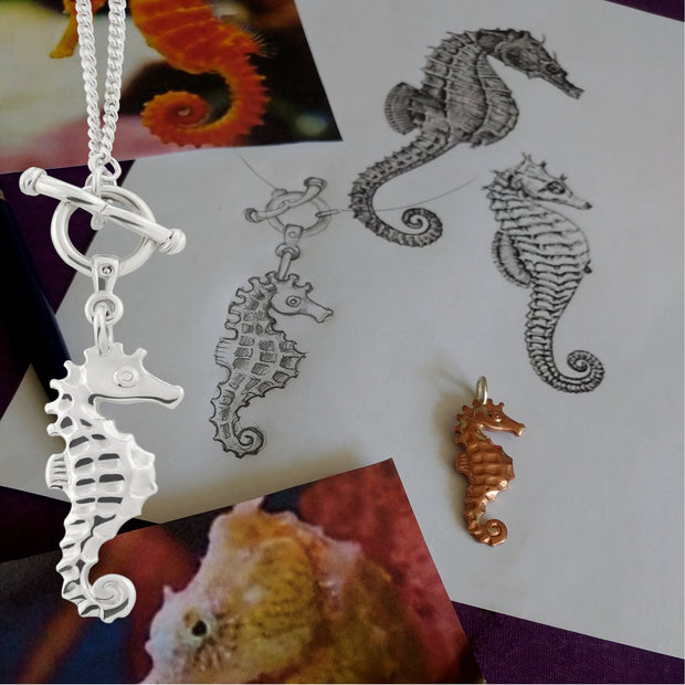 The making of a solid sterling silver designer handcarved silver seahorse necklace with toggle and ring feature clasp.