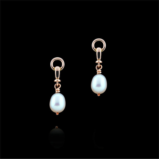 designer rose gold and cultured pearl ascot drop earrings on black background