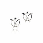 solid silver designer wrought iron inspired earrings on white background.