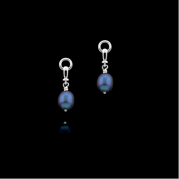 designer silver and black pearl snaffle drop earrings on black background