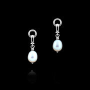 designer solid silver and cultured pearl ascot drop earring on black background.