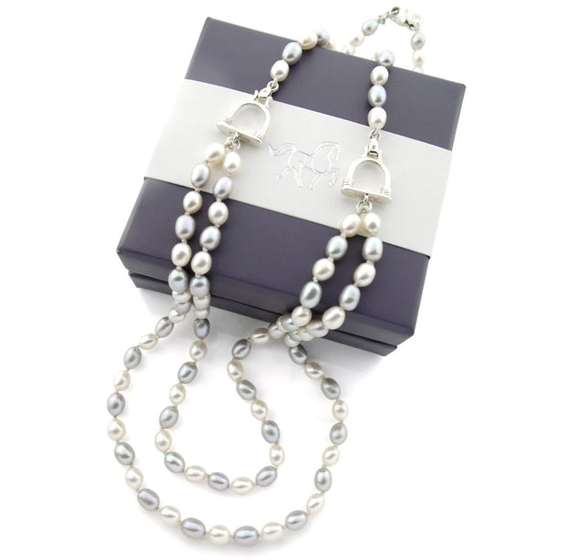 designer double strand of grey and cream pearl with stirrup detail necklace on white background