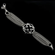 designer multistrand silver chain bracelet with wrought ironwork inspired central motif