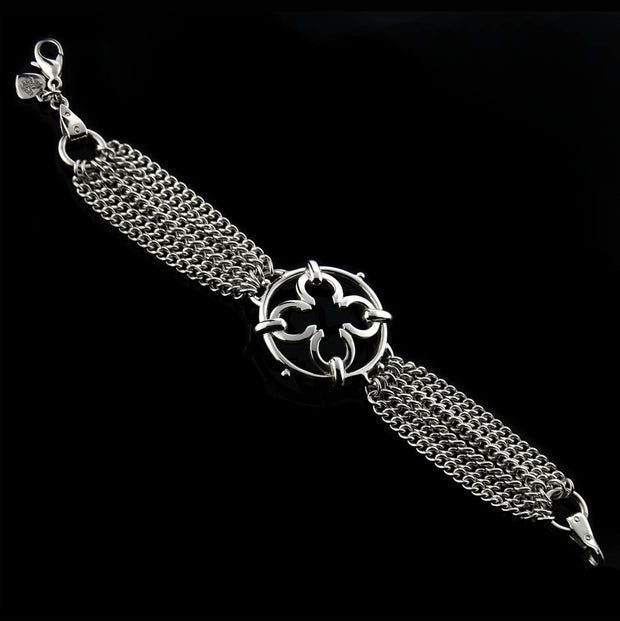 designer multistrand silver chain bracelet with wrought ironwork inspired central motif
