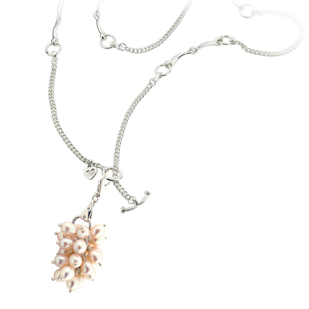 designer silver lariat equestrian bit and chain necklace with cultured pearl bauble on white background