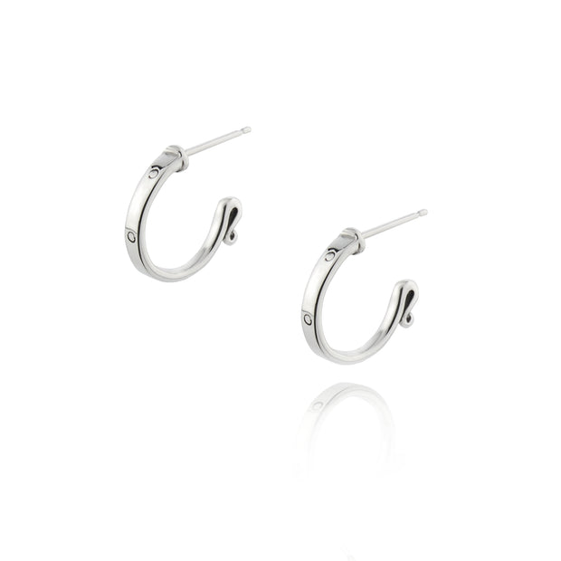 designer solid silver leather strap hoop earrings on white background
