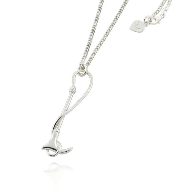 Designer solid silver hunting crop necklace on white background.