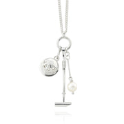 Designer Solid silver and cultured pearl polo necklace with mallet helmet and ball on white background.